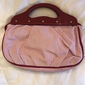 LOFT maroon and white bag with resin handle and magnetic closure.